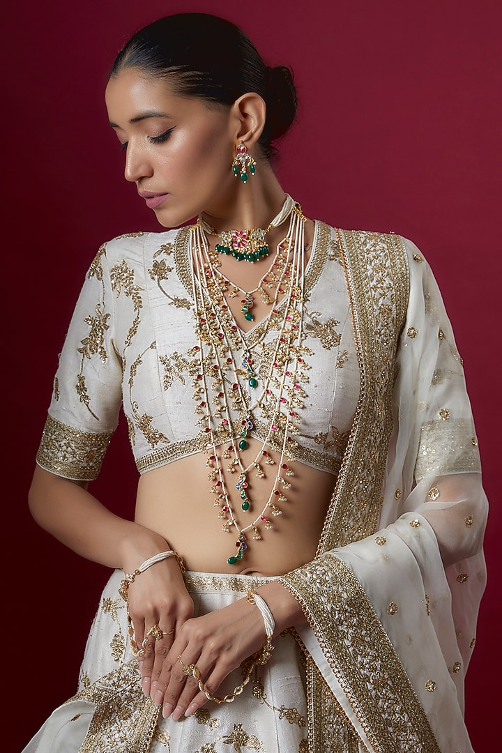 Off-White Raw Silk Embroidered Bridal Lehenga Set by Pooja & Keyur at Pernia's Pop Up Shop