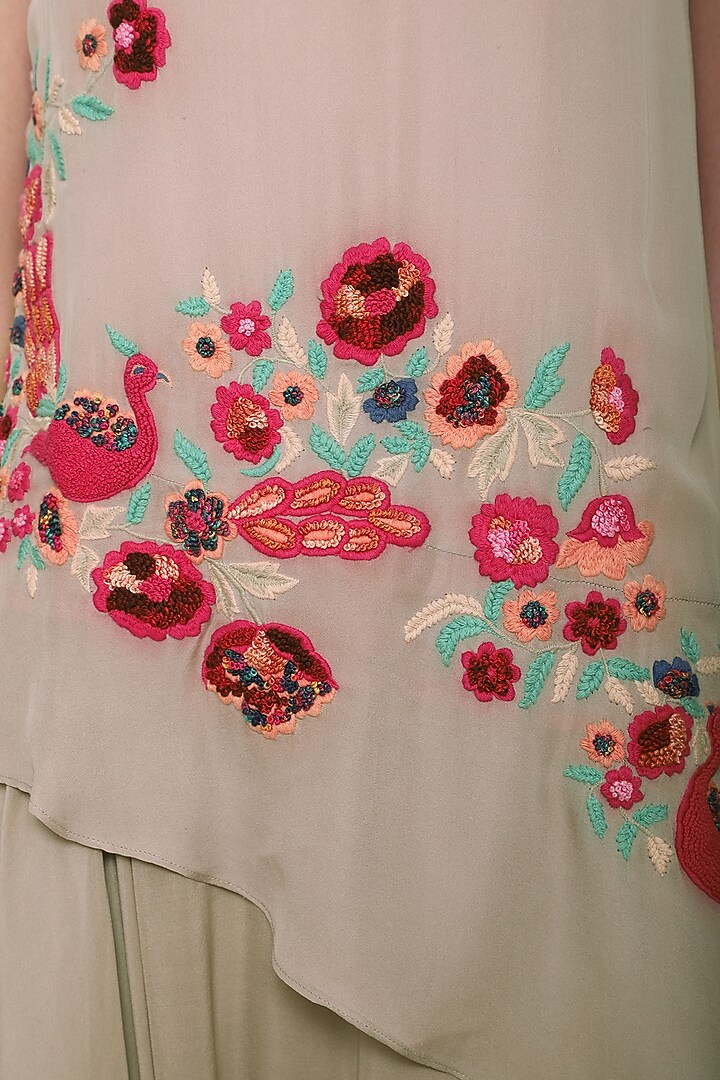 Warm grey floral and peacock embroidered asymmetrical top available only at Pernia's Pop Up Shop.