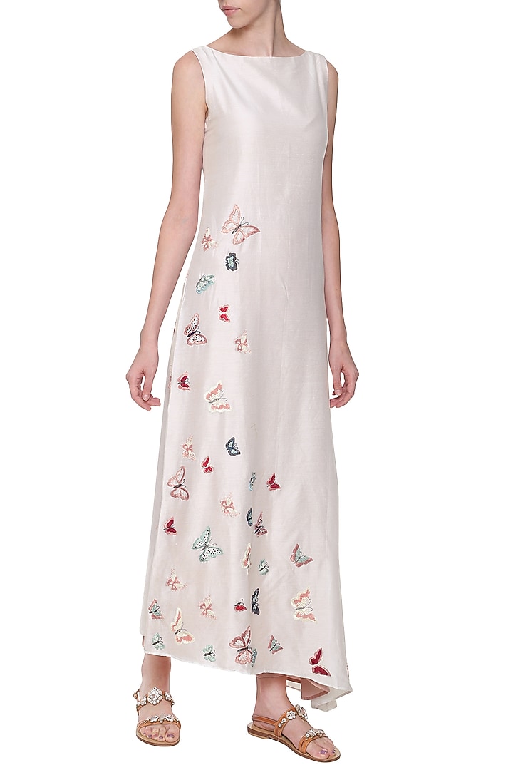 White asymmetrical embroidered kurta set available only at Pernia's Pop Up Shop.