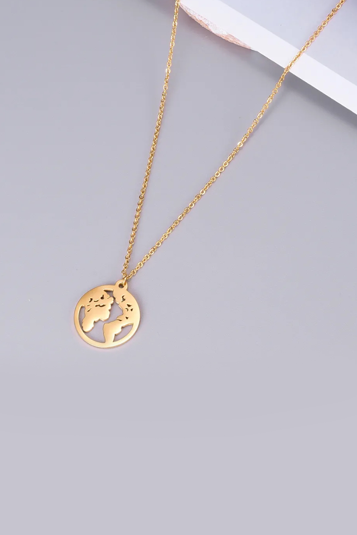 Gold Plated World Globe Necklace by Peachy Accessories at Pernia's Pop Up Shop