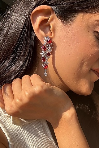 White Finish Red Stone Dangler Earrings In Sterling Silver by PRATA