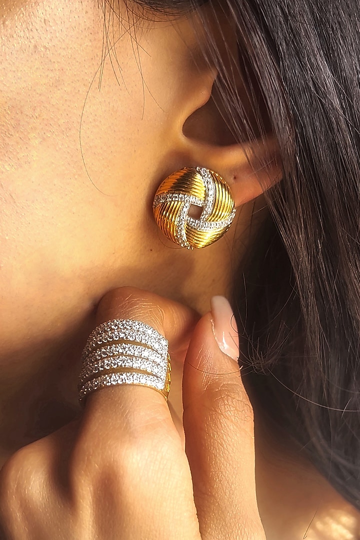 Gold Finish Imported Cubic Zirconia Textured Swirl Stud Earrings In Sterling Silver by PRATA at Pernia's Pop Up Shop