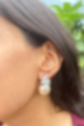 White Finish Fancy-Cut Cubic Zirconia & Round Pearl Floral Stud Earrings In Sterling Silver by PRATA at Pernia's Pop Up Shop