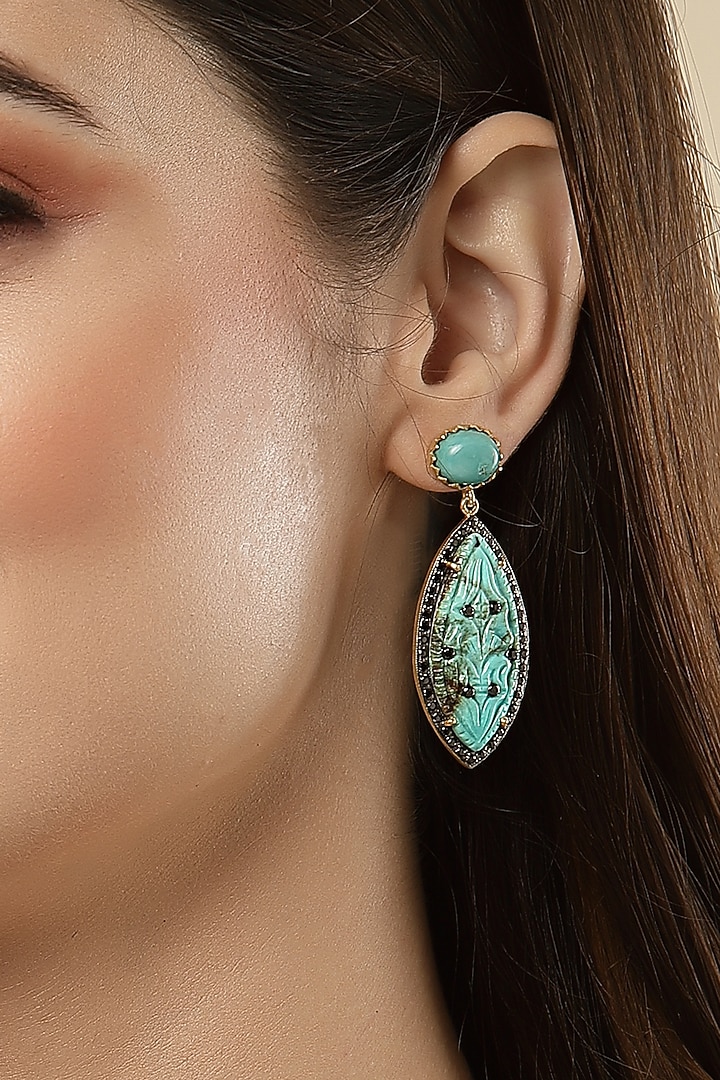 Gold Finish Carved Turquoise Stone Dangler Earrings In Sterling Silver by Jewels by Praccessorii at Pernia's Pop Up Shop