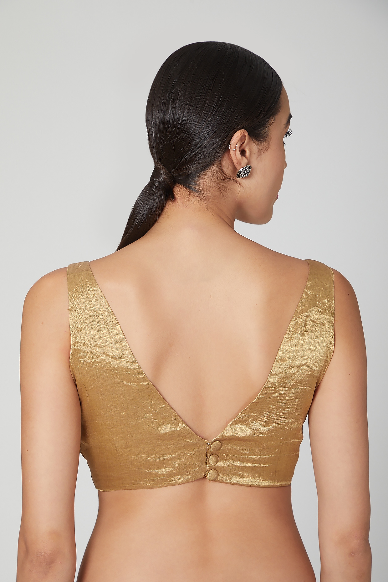 gold sleeveless top