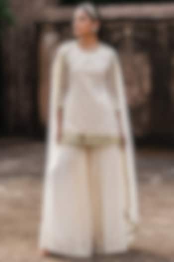 Off-White Cotton Shimmer Mulmul Embroidered Party Wear Sharara Set by PREEVIN at Pernia's Pop Up Shop