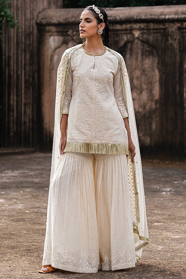 Off-White Cotton Shimmer Mulmul Embroidered Party Wear Sharara Set by PREEVIN at Pernia's Pop Up Shop