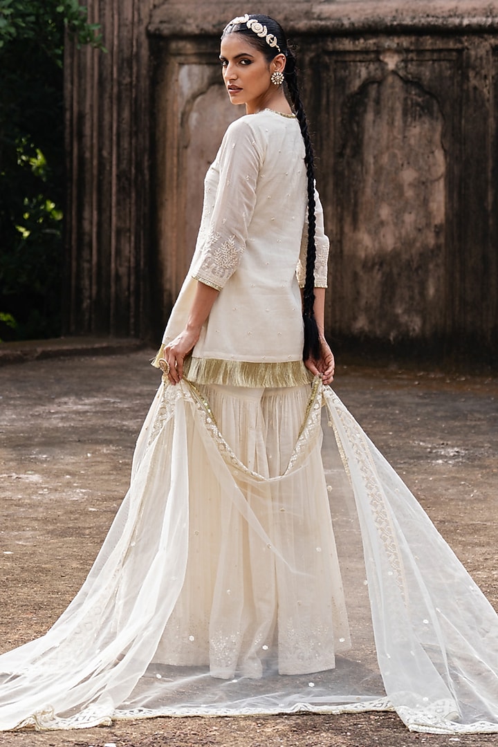 Off-White Cotton Shimmer Mulmul Embroidered Party Wear Sharara Set by PREEVIN at Pernia's Pop Up Shop