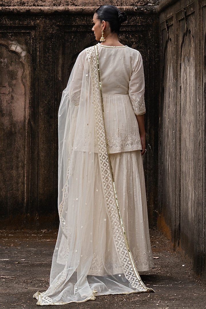 Off-White Shimmer Mulmul Embroidered Party Wear Sharara Set by PREEVIN at Pernia's Pop Up Shop