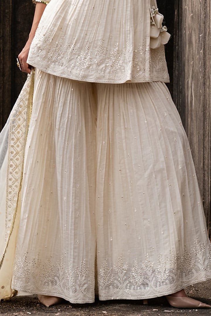 Off-White Shimmer Mulmul Embroidered Party Wear Sharara Set by PREEVIN at Pernia's Pop Up Shop