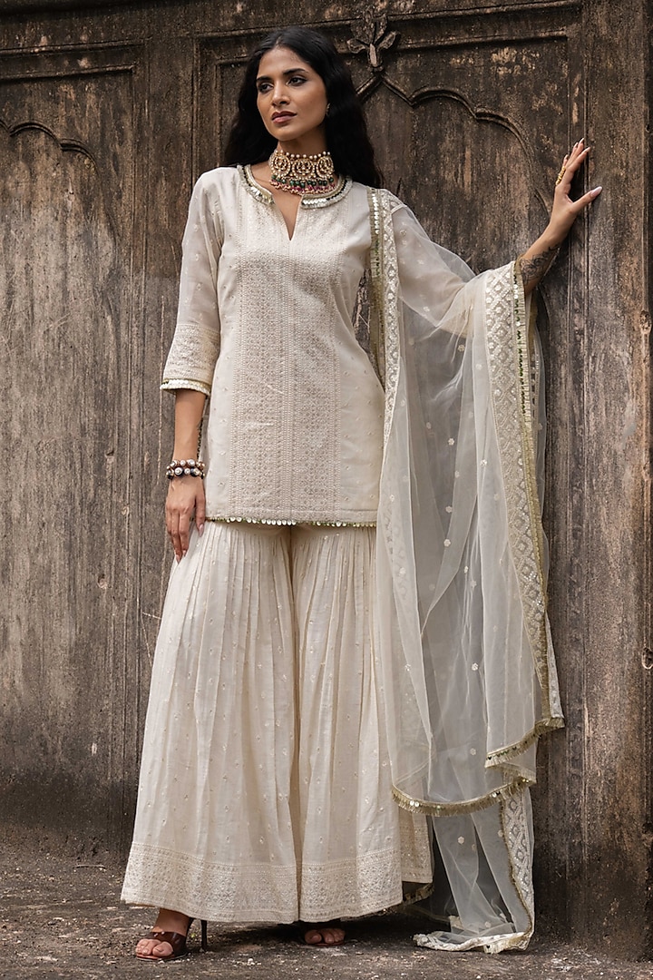 Off-White Cotton Shimmer Mulmul Embroidered Party Wear Sharara Set by PREEVIN at Pernia's Pop Up Shop