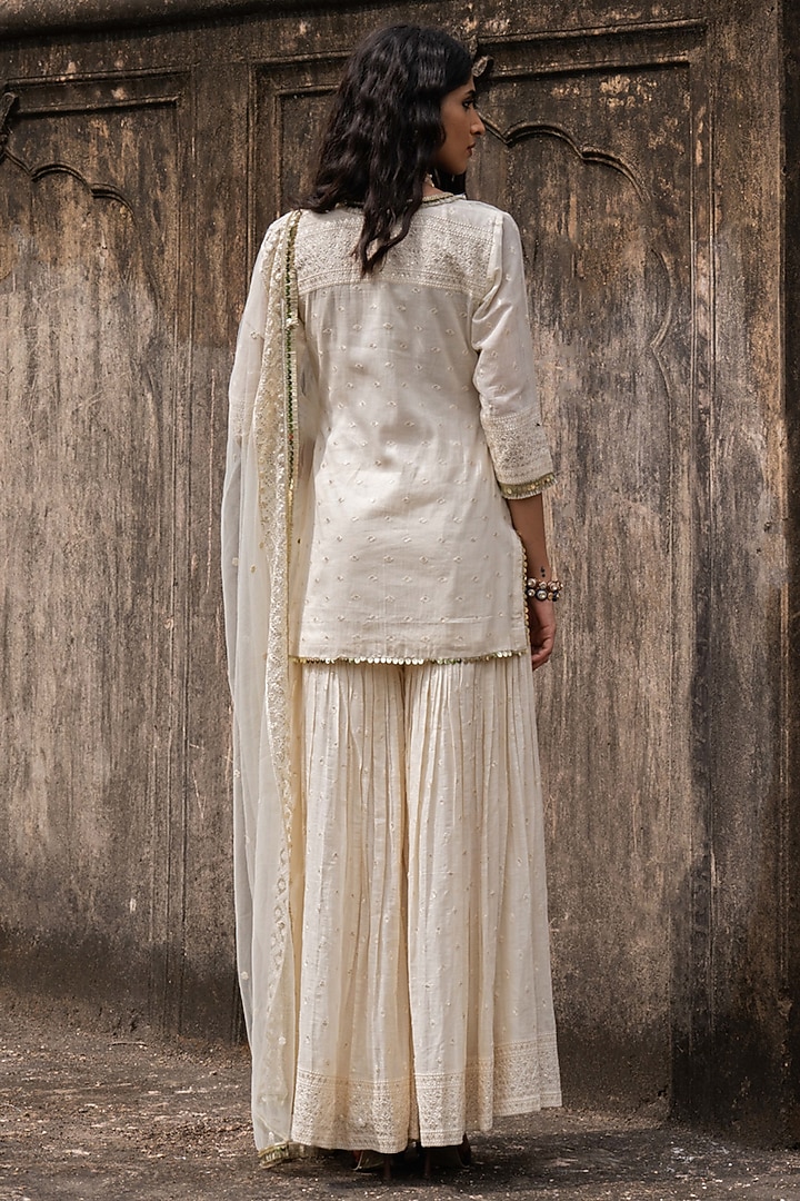 Off-White Cotton Shimmer Mulmul Embroidered Party Wear Sharara Set by PREEVIN at Pernia's Pop Up Shop