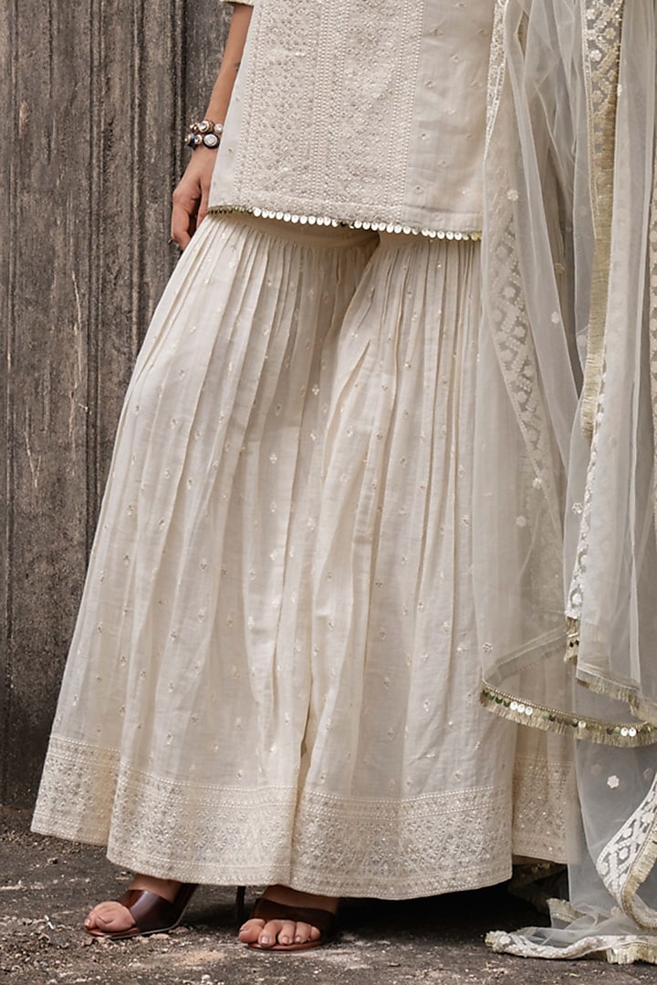 Off-White Cotton Shimmer Mulmul Embroidered Party Wear Sharara Set by PREEVIN at Pernia's Pop Up Shop