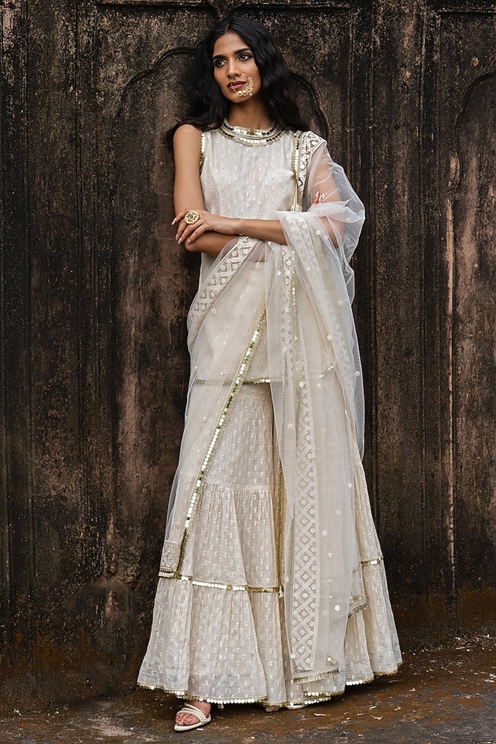 Off-White Cotton Shimmer Mulmul Embroidered Party Wear Sharara Set by PREEVIN at Pernia's Pop Up Shop