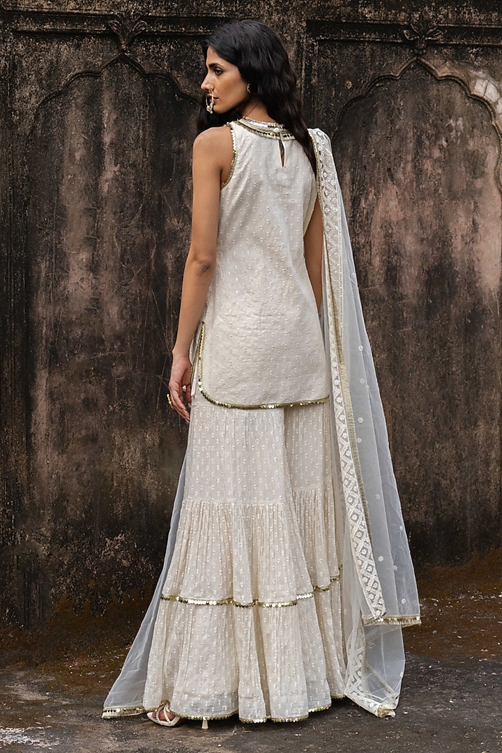 Off-White Cotton Shimmer Mulmul Embroidered Party Wear Sharara Set by PREEVIN at Pernia's Pop Up Shop