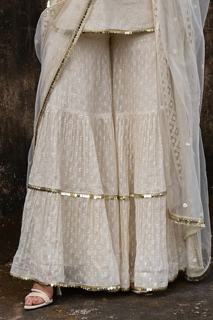 Off-White Cotton Shimmer Mulmul Embroidered Party Wear Sharara Set by PREEVIN at Pernia's Pop Up Shop