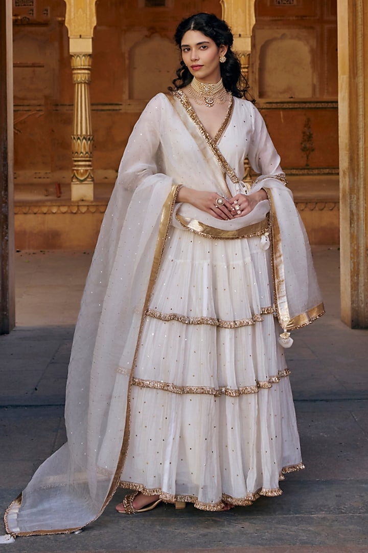 Ivory Chanderi Silk Mukaish Handwork Tiered Angrakha With Dupatta by PREEVIN at Pernia's Pop Up Shop
