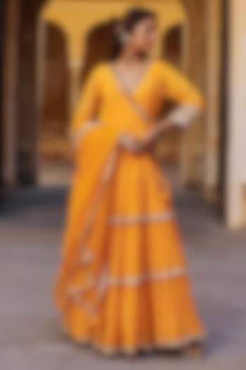 Saffron Chanderi Silk Mukaish Handwork Tiered Angrakha With Dupatta by PREEVIN at Pernia's Pop Up Shop