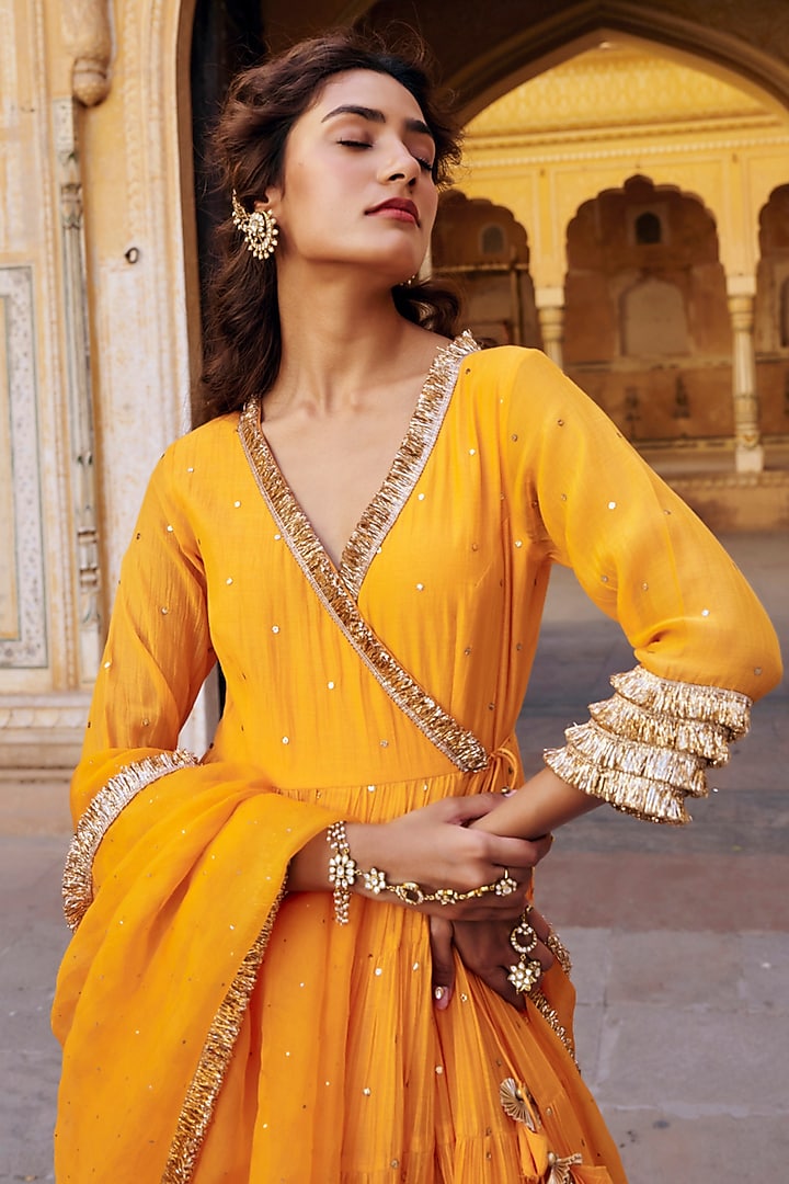 Saffron Chanderi Silk Mukaish Handwork Tiered Angrakha With Dupatta by PREEVIN at Pernia's Pop Up Shop