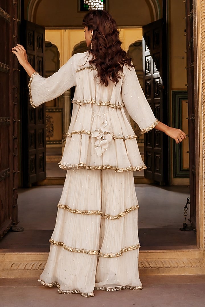 Ivory Chanderi Silk Mukaish Handwork Tiered Party Wear Sharara Set by PREEVIN at Pernia's Pop Up Shop