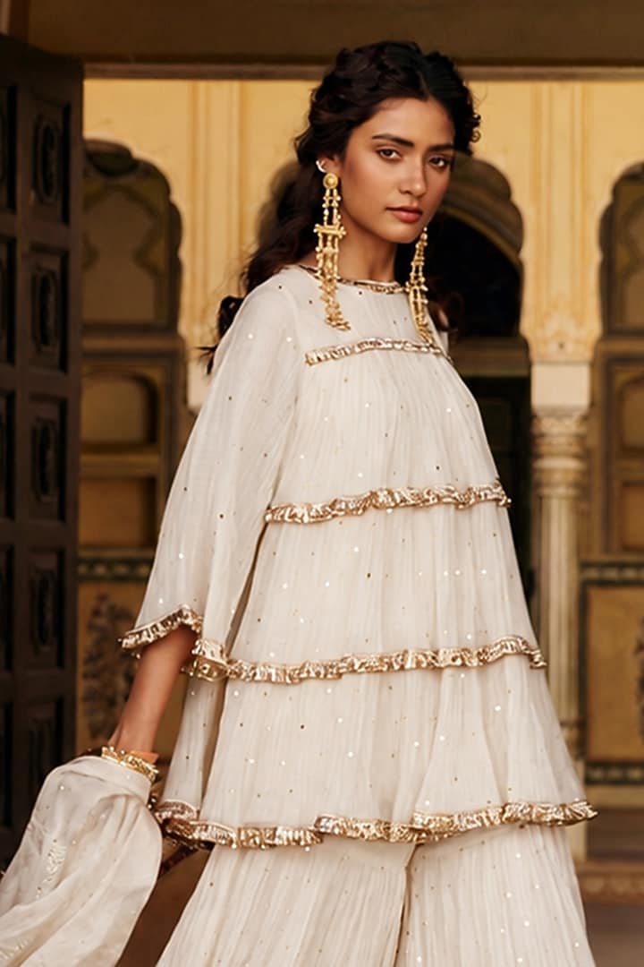 Ivory Chanderi Silk Mukaish Handwork Tiered Party Wear Sharara Set by PREEVIN at Pernia's Pop Up Shop