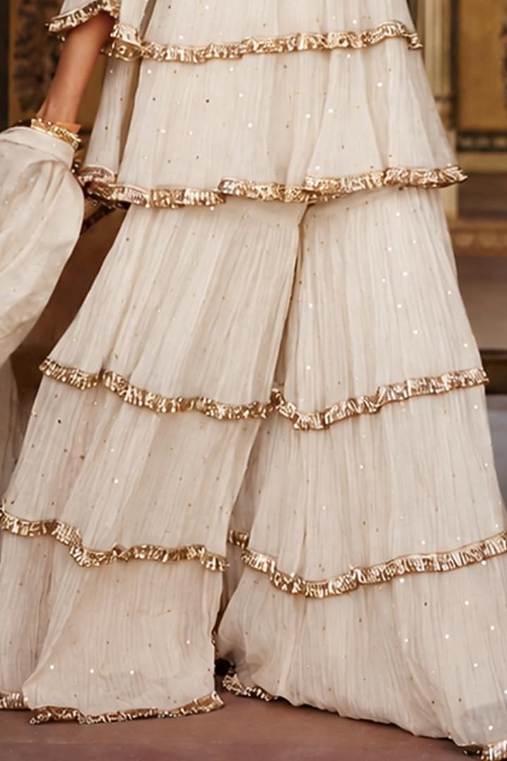 Ivory Chanderi Silk Mukaish Handwork Tiered Party Wear Sharara Set by PREEVIN at Pernia's Pop Up Shop