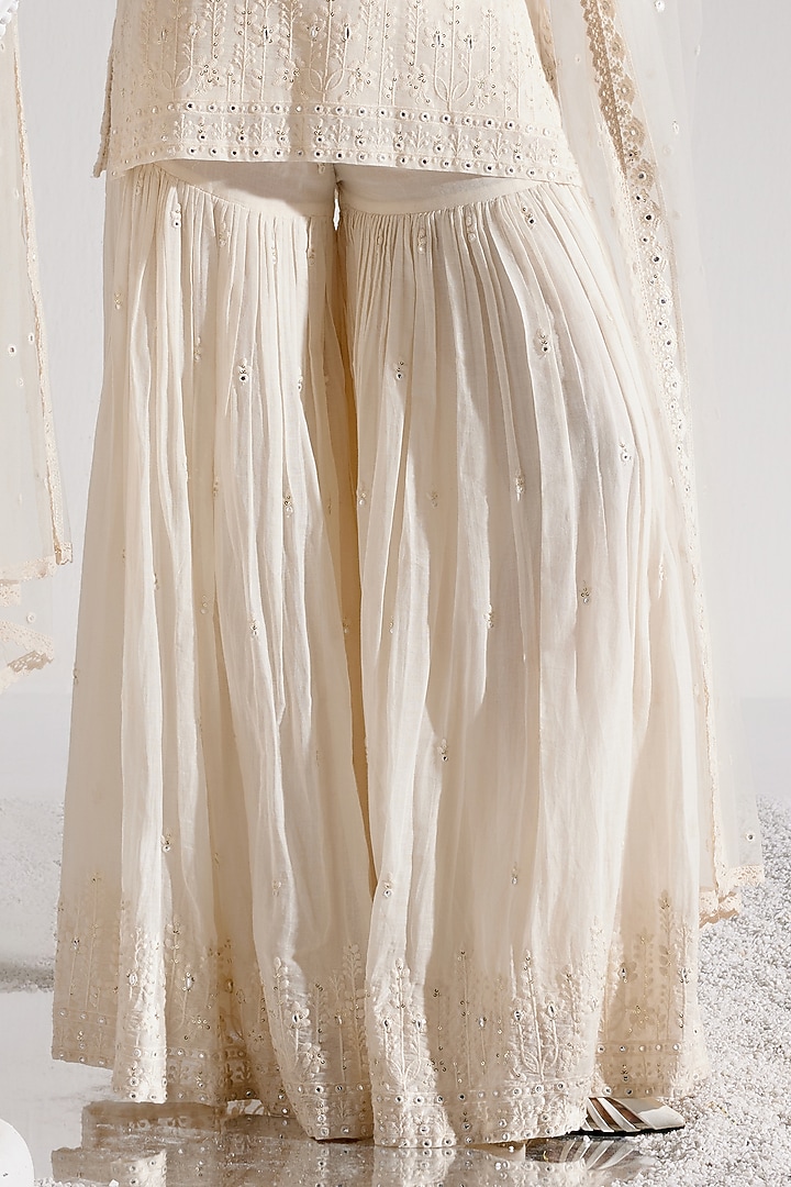 Off-White Cotton Mulmul Thread & MIrror Work Party Wear Sharara Set by PREEVIN at Pernia's Pop Up Shop