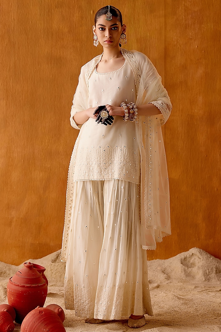 Off-White Cotton Mulmul Thread & Mirror Work Party Wear Sharara Set by PREEVIN at Pernia's Pop Up Shop