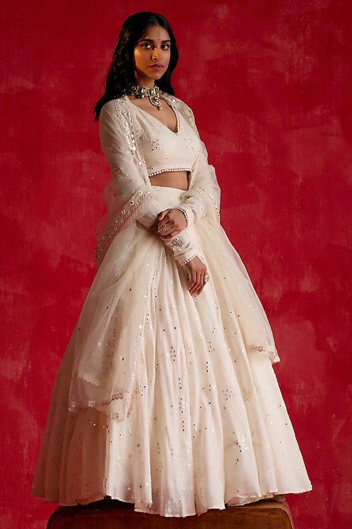 Off-White Cotton Mulmul Thread & Mirror Work Lehenga Set by PREEVIN at Pernia's Pop Up Shop