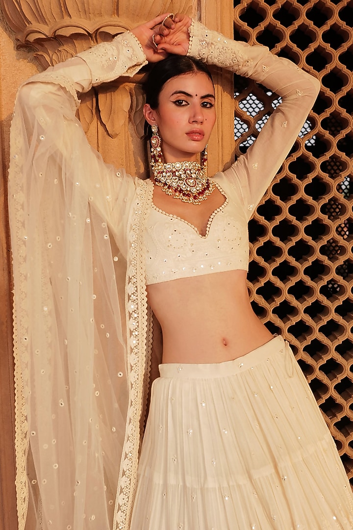 Off-White Cotton Mulmul Mirror & Thread Embroidered Lehenga Set by PREEVIN at Pernia's Pop Up Shop