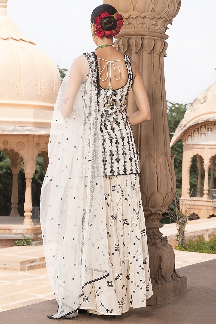 Black & White Cotton Mulmul Thread Embroidered Party Wear Sharara Set by PREEVIN at Pernia's Pop Up Shop