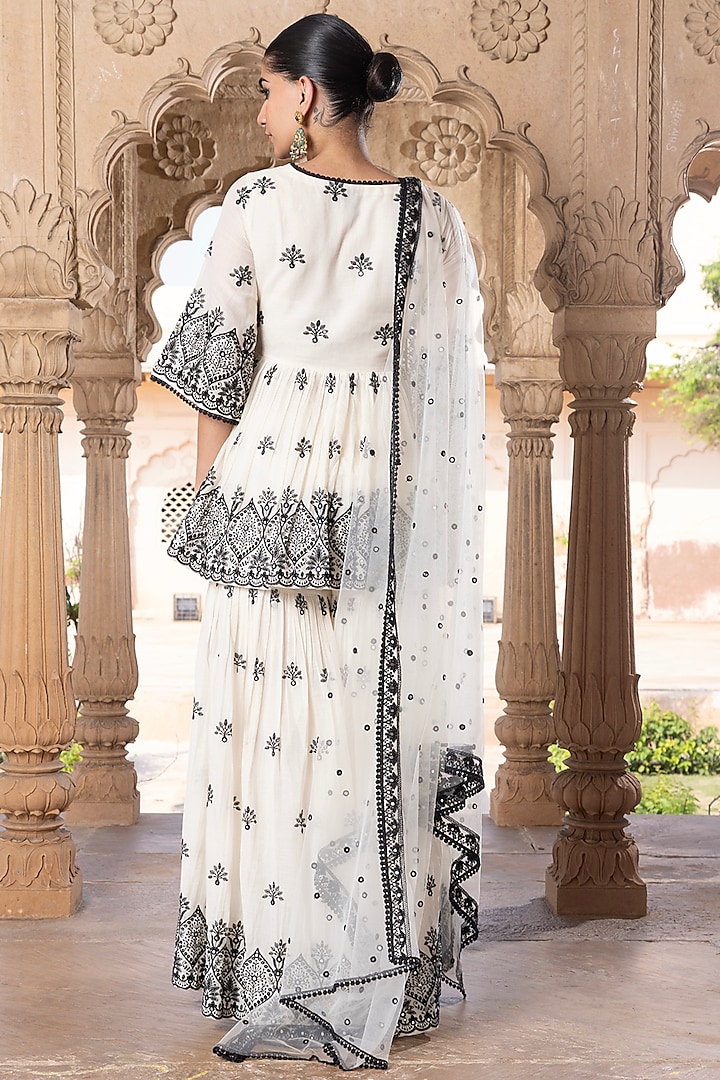 Black & White Cotton Mulmul Thread Embroidered Party Wear Sharara Set by PREEVIN at Pernia's Pop Up Shop