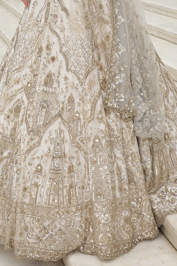 Ivory Net Crystal Hand Embroidered Bridal Lehenga Set by PRESTO COUTURE at Pernia's Pop Up Shop