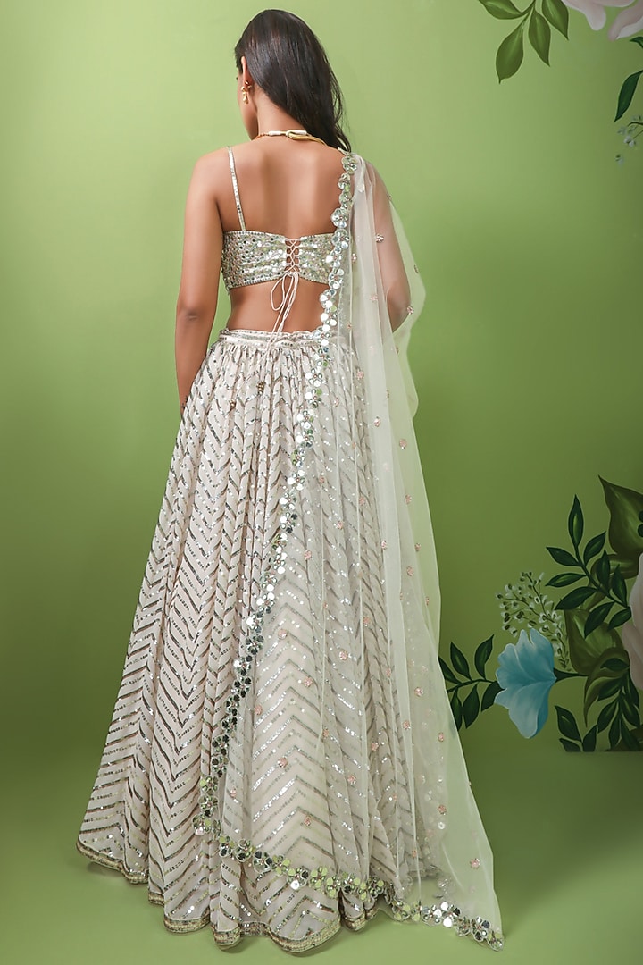 Ivory Embroidered Wedding Lehenga Set by Prevasu at Pernia's Pop Up Shop