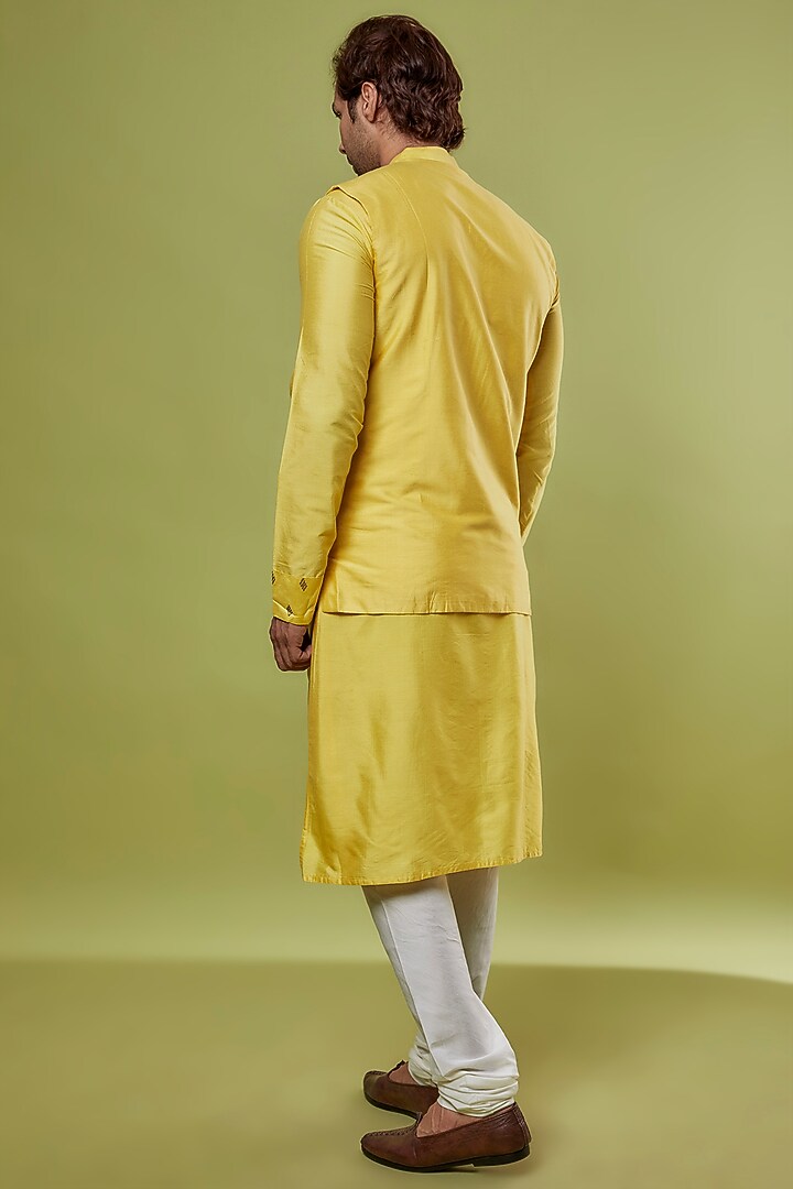 Yellow Banarasi Silk & Katan Silk Embroidered Bundi Jacket With Kurta Set by PRIYANKA HARALALKA at Pernia's Pop Up Shop