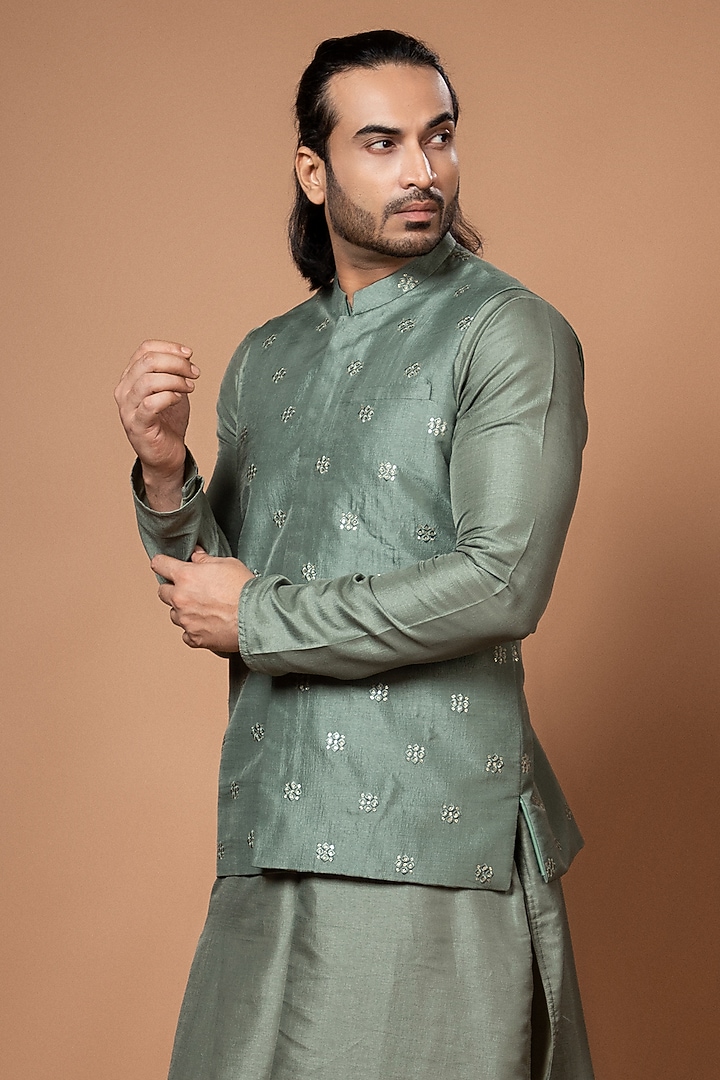 Olive Green Silk & Cotton Silk Machine Embroidered Bundi Jacket Set by PRIYANKA HARALALKA at Pernia's Pop Up Shop