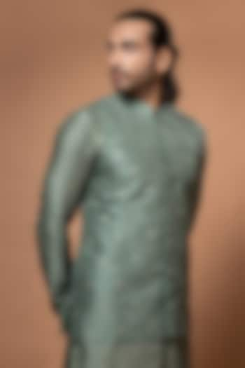 Olive Green Silk & Cotton Silk Machine Embroidered Bundi Jacket by PRIYANKA HARALALKA