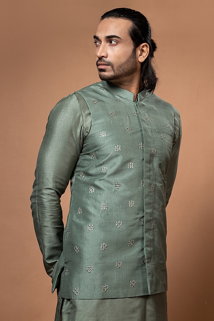 Olive Green Silk & Cotton Silk Machine Embroidered Bundi Jacket by PRIYANKA HARALALKA