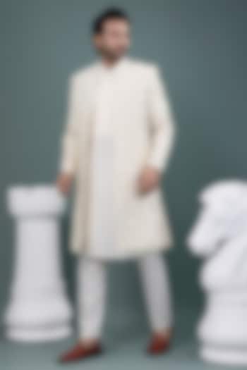 Ivory Raw Silk & Cotton Silk Hand Embroidered Wedding Sherwani Set by PRIYANKA HARALALKA at Pernia's Pop Up Shop