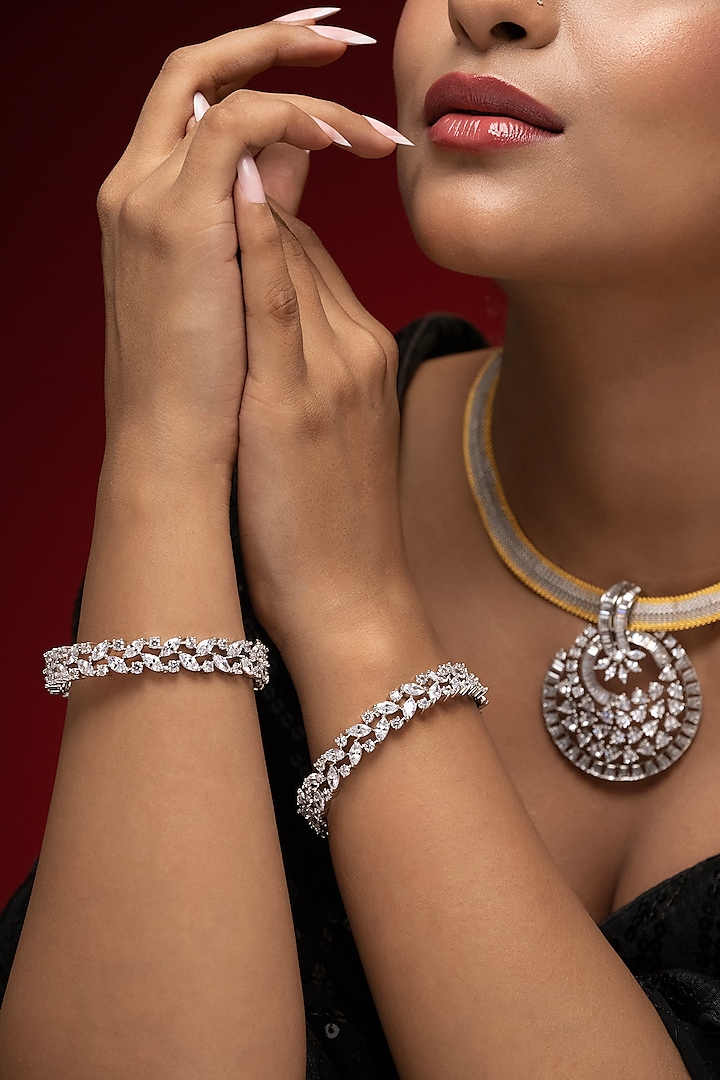 White Finish Cubic Zirconia Bangles (Set Of 2) by Prihan Luxury Jewelry at Pernia's Pop Up Shop