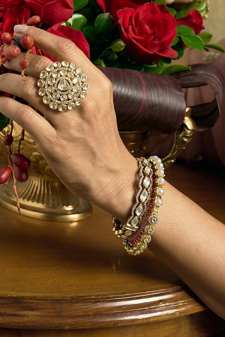 Gold Finish Pink & Green Kundan Polki Bangles (Set Of 2) by Preeti Mohan at Pernia's Pop Up Shop