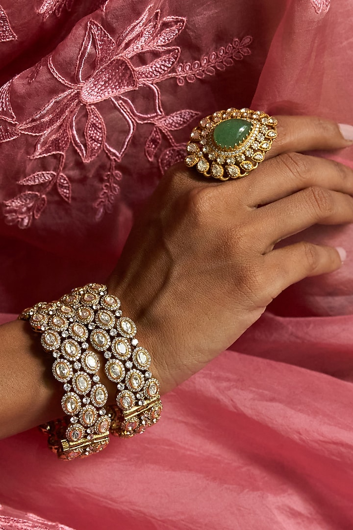 Antique Gold Finish Kundan Polki Bangles (Set Of 2) by Preeti Mohan at Pernia's Pop Up Shop