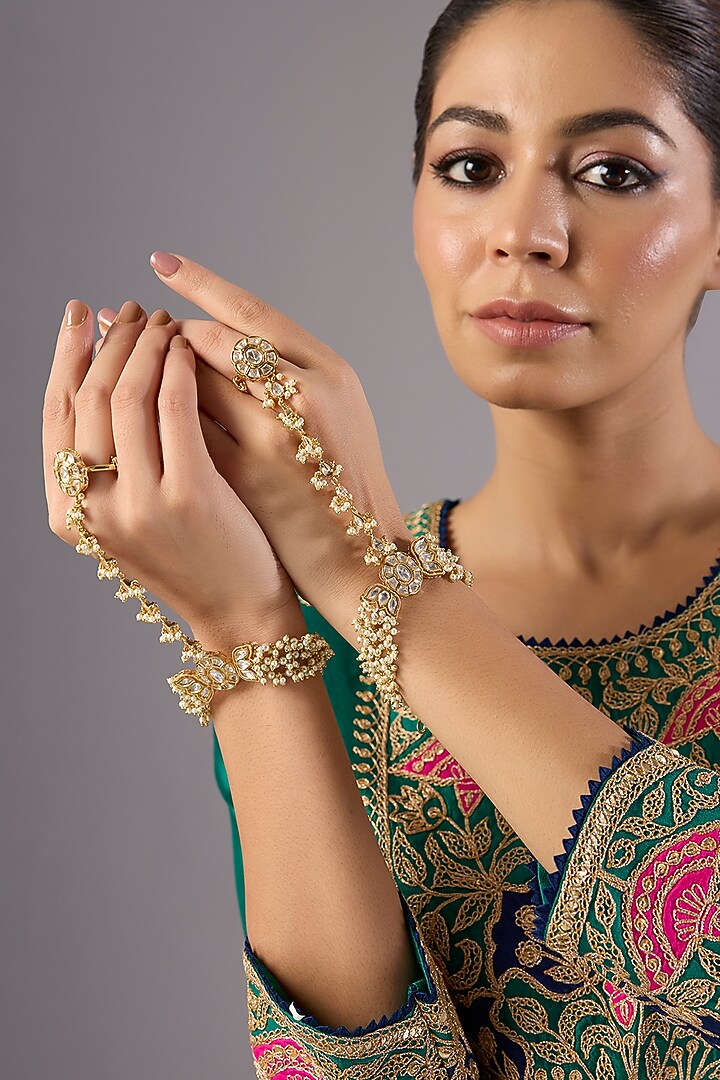 Gold Finish White Kundan Polki Haathphool (Set Of 2) by Preeti Mohan at Pernia's Pop Up Shop