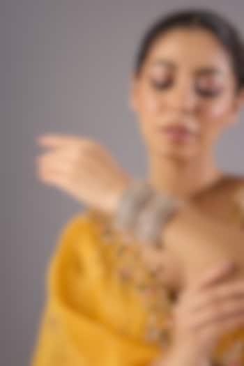 Antique Gold Finish Kundan Polki & Pearl Bangles (Set Of 2) by Preeti Mohan at Pernia's Pop Up Shop