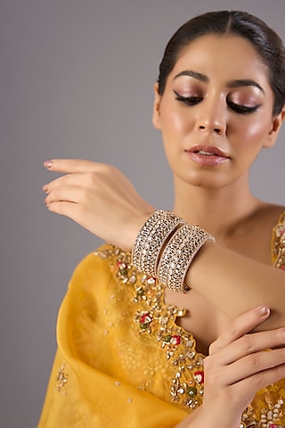 Antique Gold Finish Kundan Polki & Pearl Bangles (Set Of 2) by Preeti Mohan