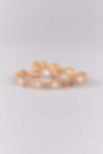 Antique Gold Finish Kundan Polki Bangles (Set Of 2) by Preeti Mohan at Pernia's Pop Up Shop