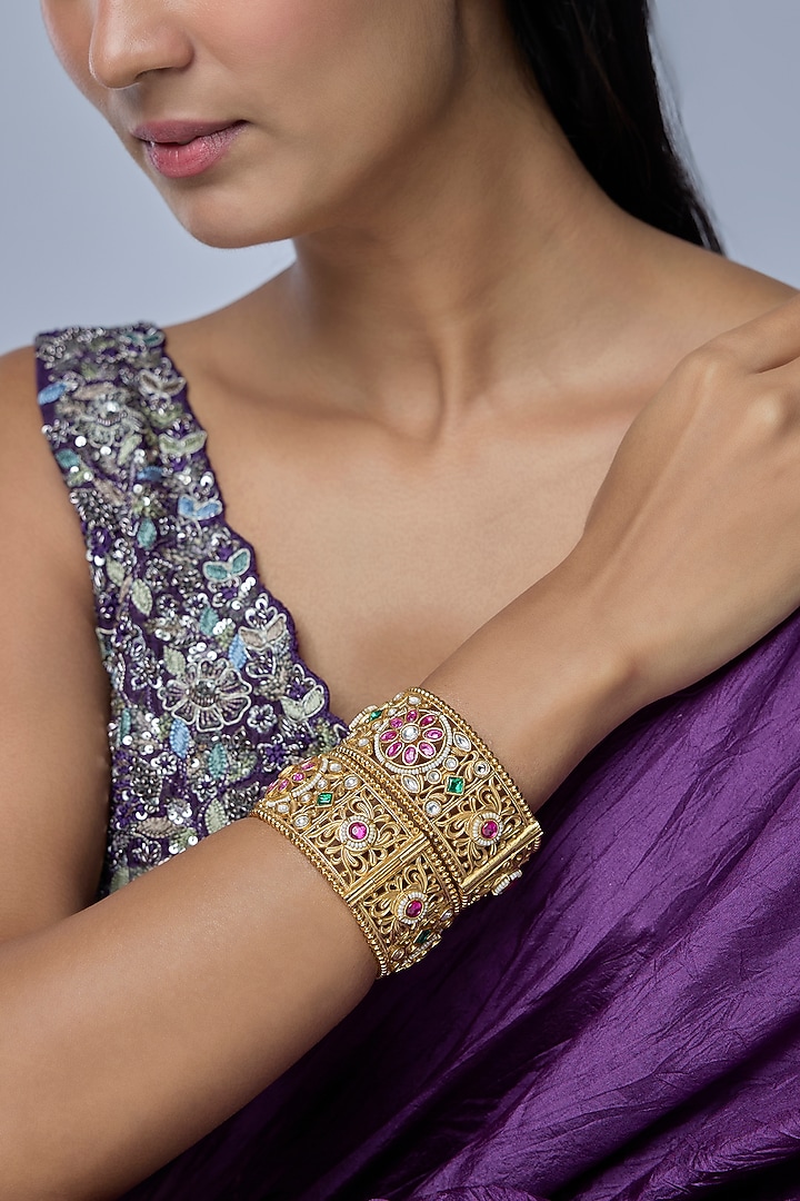 Gold Finish Kundan Polki & Multi-Colored Stone Bangles (Set Of 2) by Preeti Mohan at Pernia's Pop Up Shop