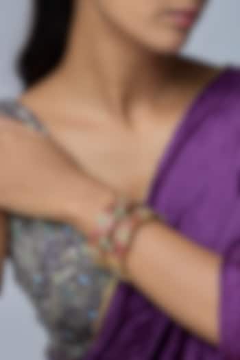 Gold Finish Kundan Polki & Red Stone Bangles (Set Of 2) by Preeti Mohan at Pernia's Pop Up Shop