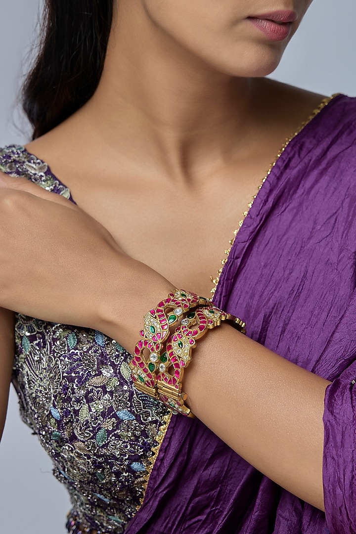 Gold Finish Kundan Polki & Red Stone Bangles (Set Of 2) by Preeti Mohan at Pernia's Pop Up Shop