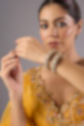 Antique Gold Finish Kundan Polki & Pearl Bangles (Set Of 2) by Preeti Mohan at Pernia's Pop Up Shop